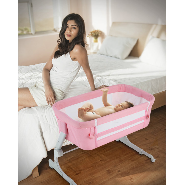 Pink discount bedside crib